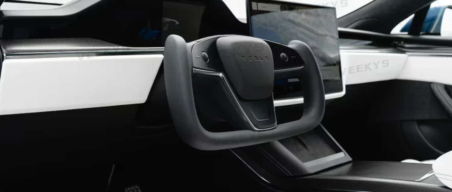 Tesla's 2021 new Model S with steering Yoke shape and stalks removed, shows more benefit or less benefit?