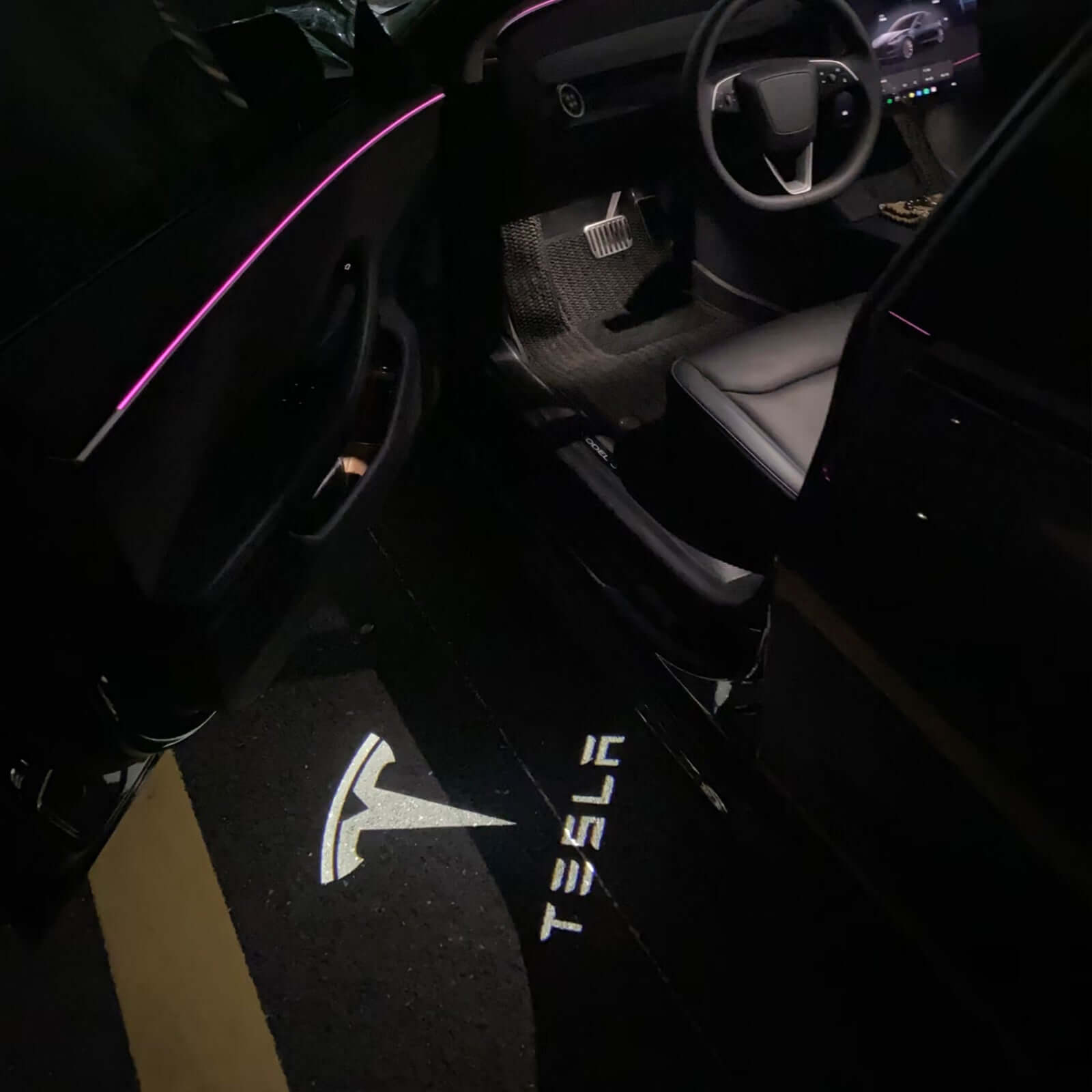 Tesla Model 3 / 3 Highland & Y / Y Juniper interior with OEM Welcome Projection Lights illuminating the ground at night