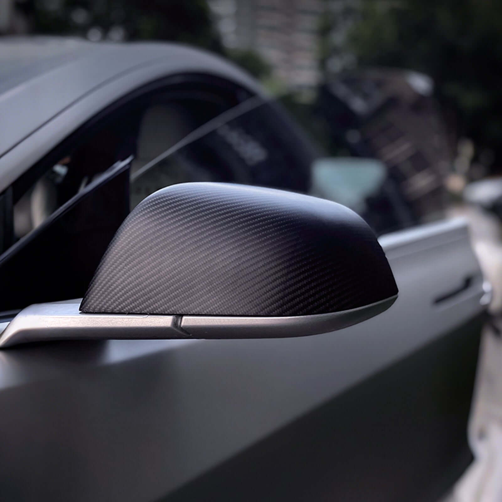 Close-up of Real Dry Carbon Fiber Mirror Covers for Tesla Model 3 Highland 2024 showing premium texture and finish
