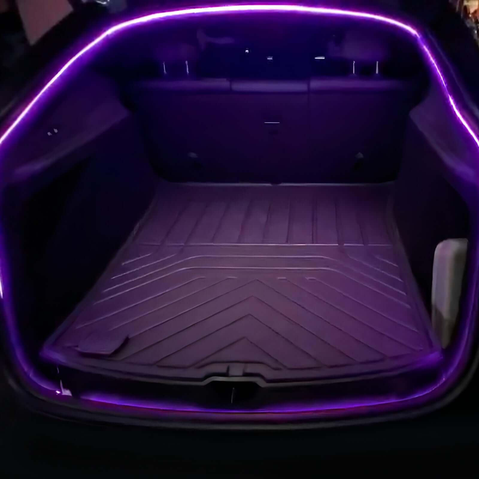 Tesla Model Y Juniper Trunk Light Pro app-controlled LED strip illuminating trunk with purple ambiance