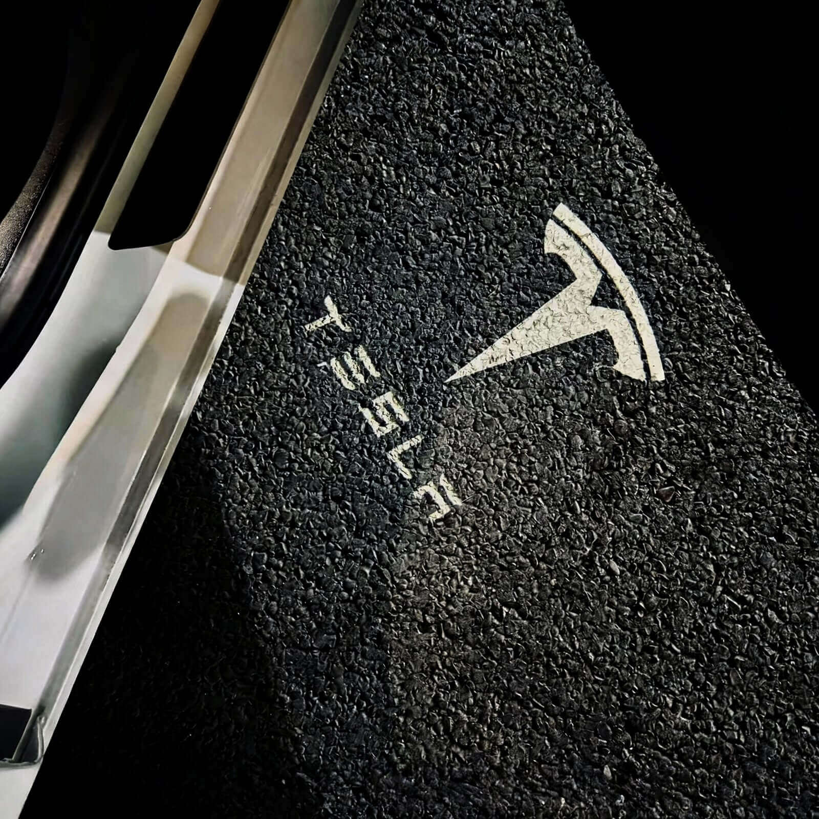 Tesla Model 3/Y welcome projection lights illuminating logo on ground with crisp clarity