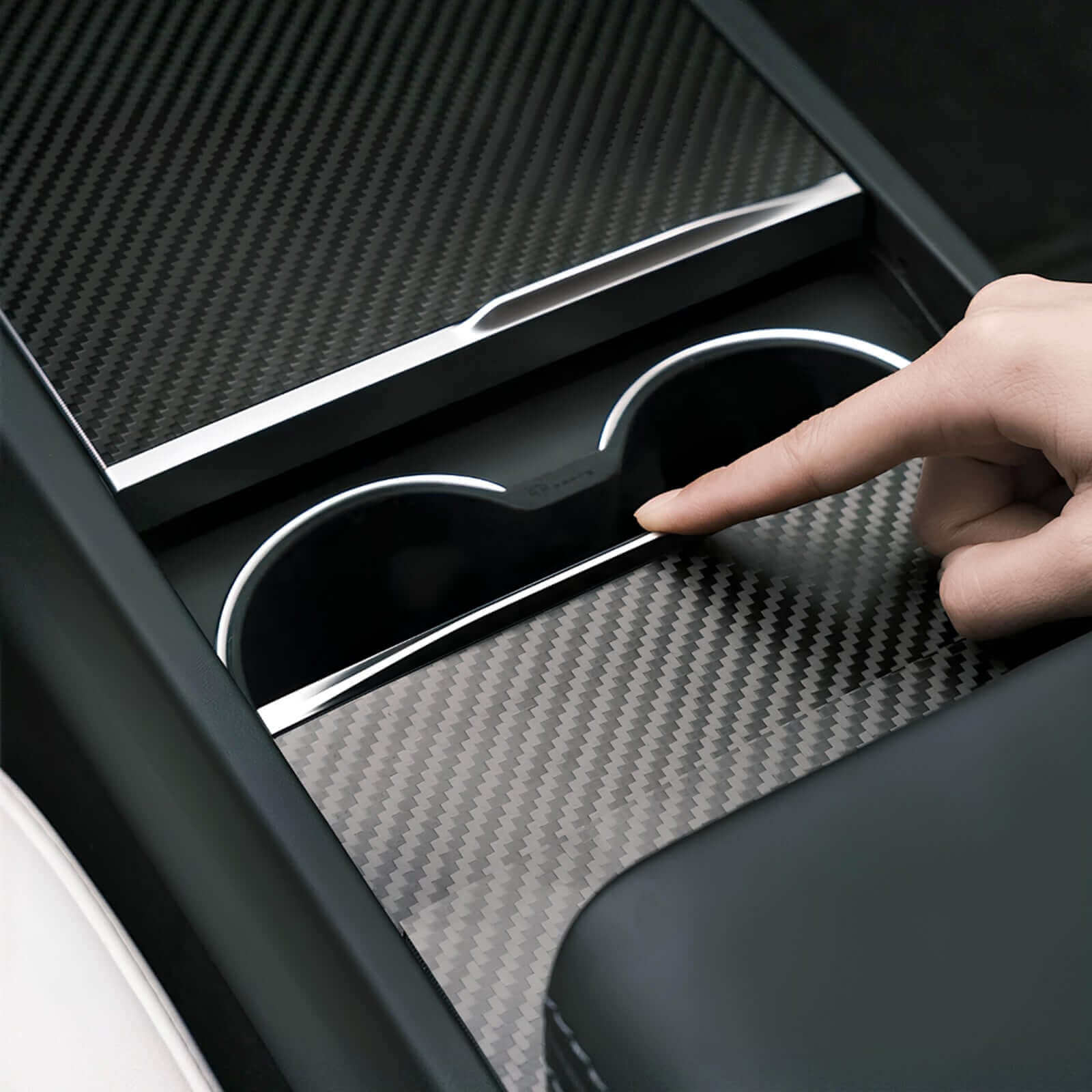 Tesla Model 3 Highland 2024 & Model Y Juniper 2025 center console cover in matte black with cup holder access in use