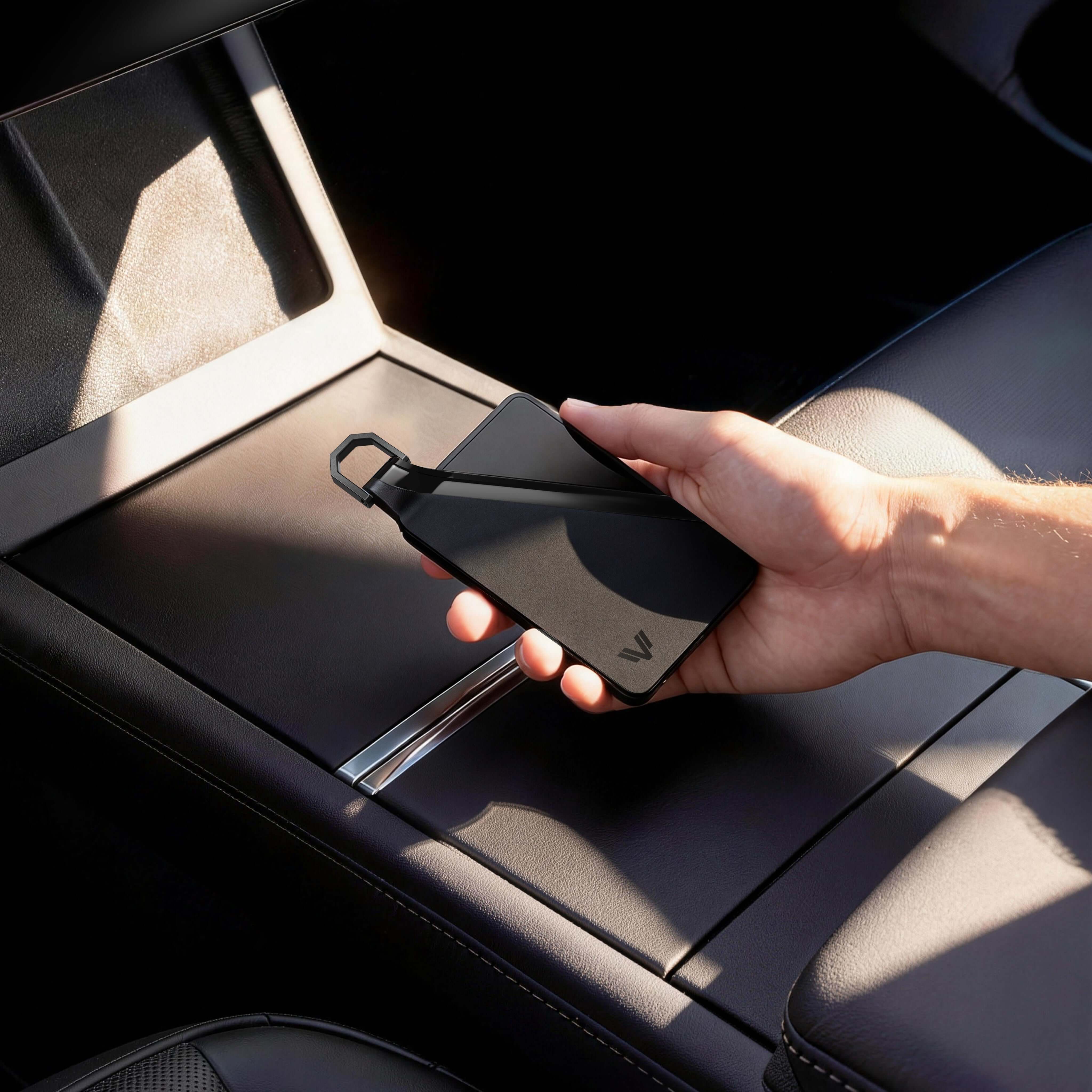 Tesla Model 3 key card holder in use on center console showing magnetic snap cover
