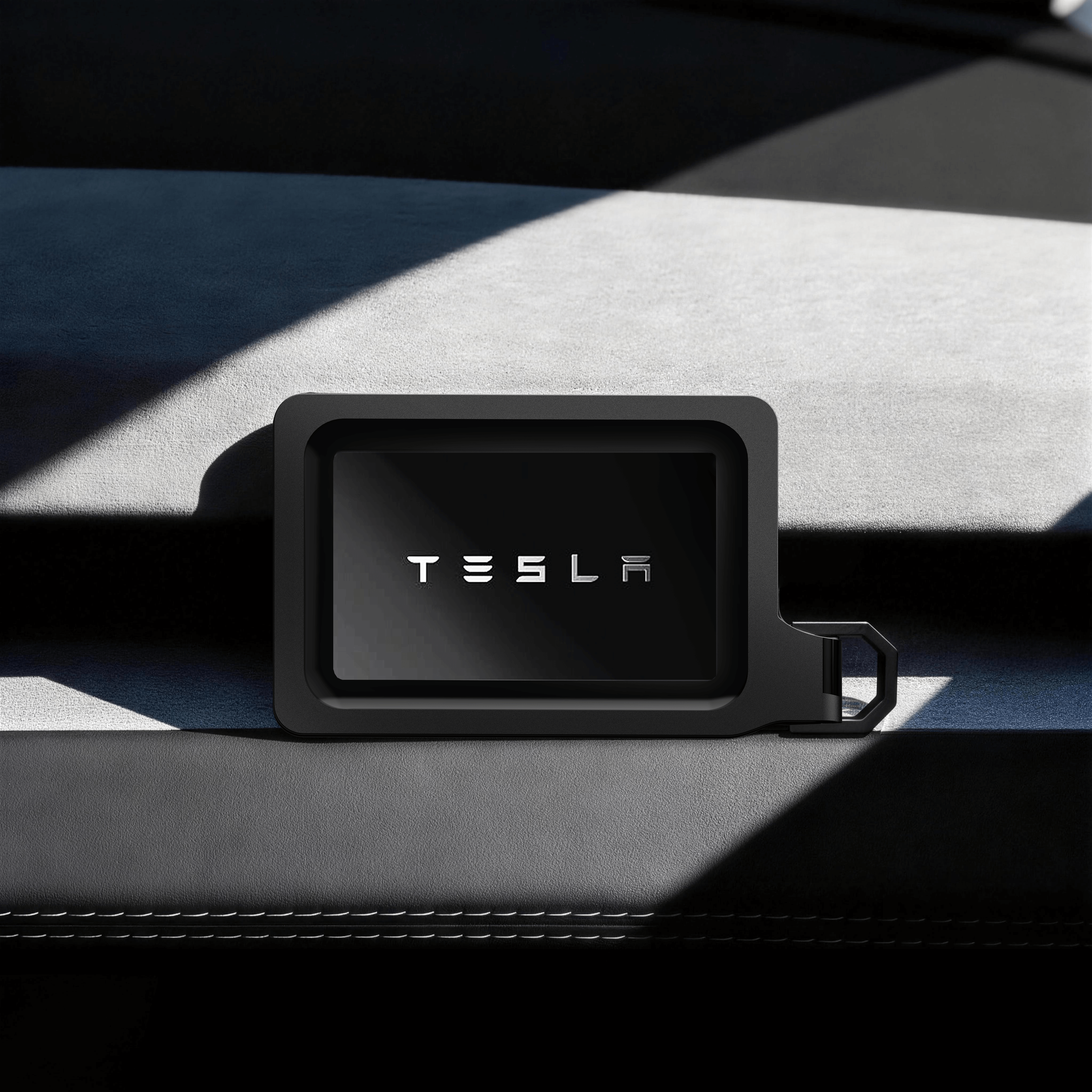 Tesla Key Card Holder - Magnetic Snap Cover & Reinforced Backplate on car dashboard in sleek black finish