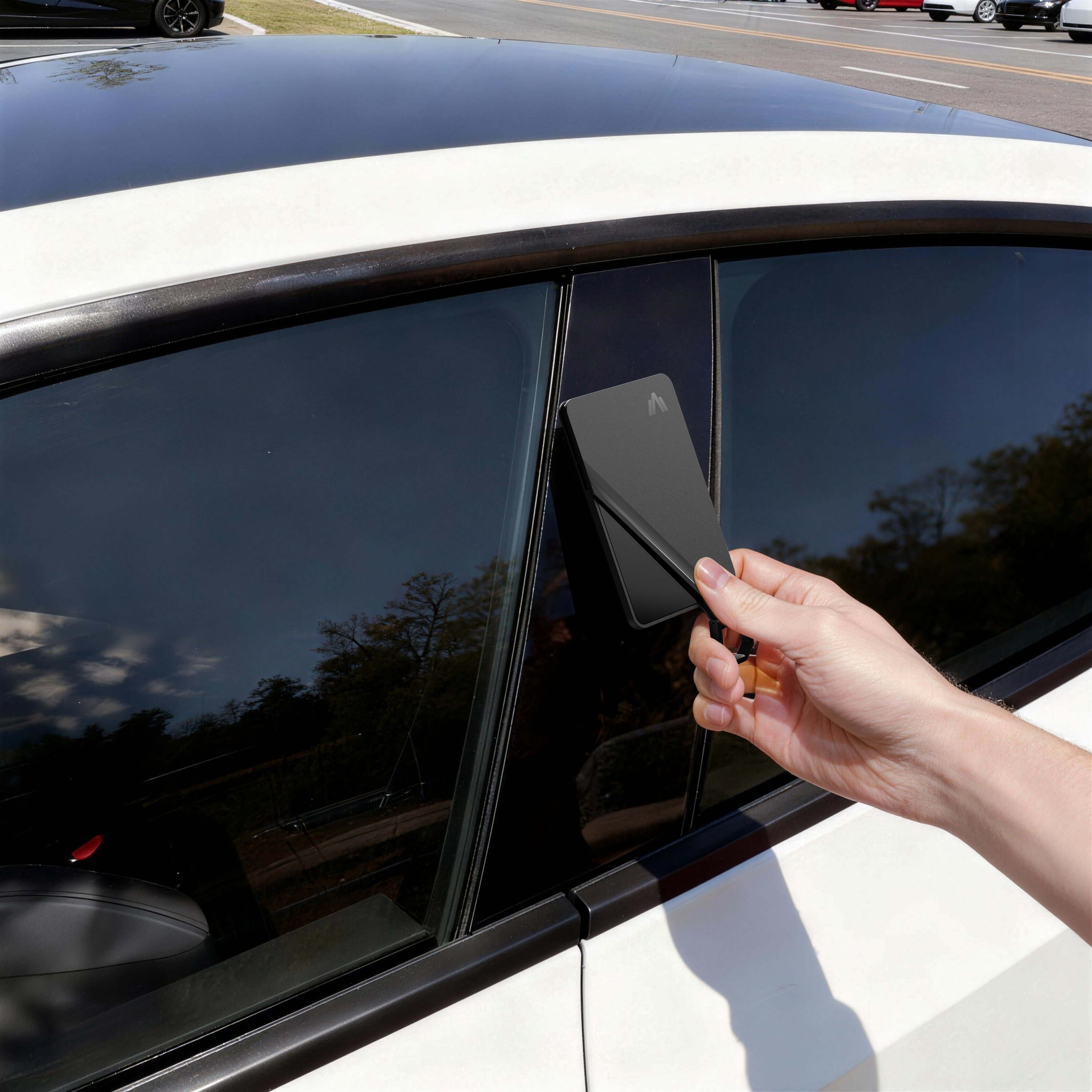 Tesla Model 3 interior with Tesla Key Card Holder in use at window