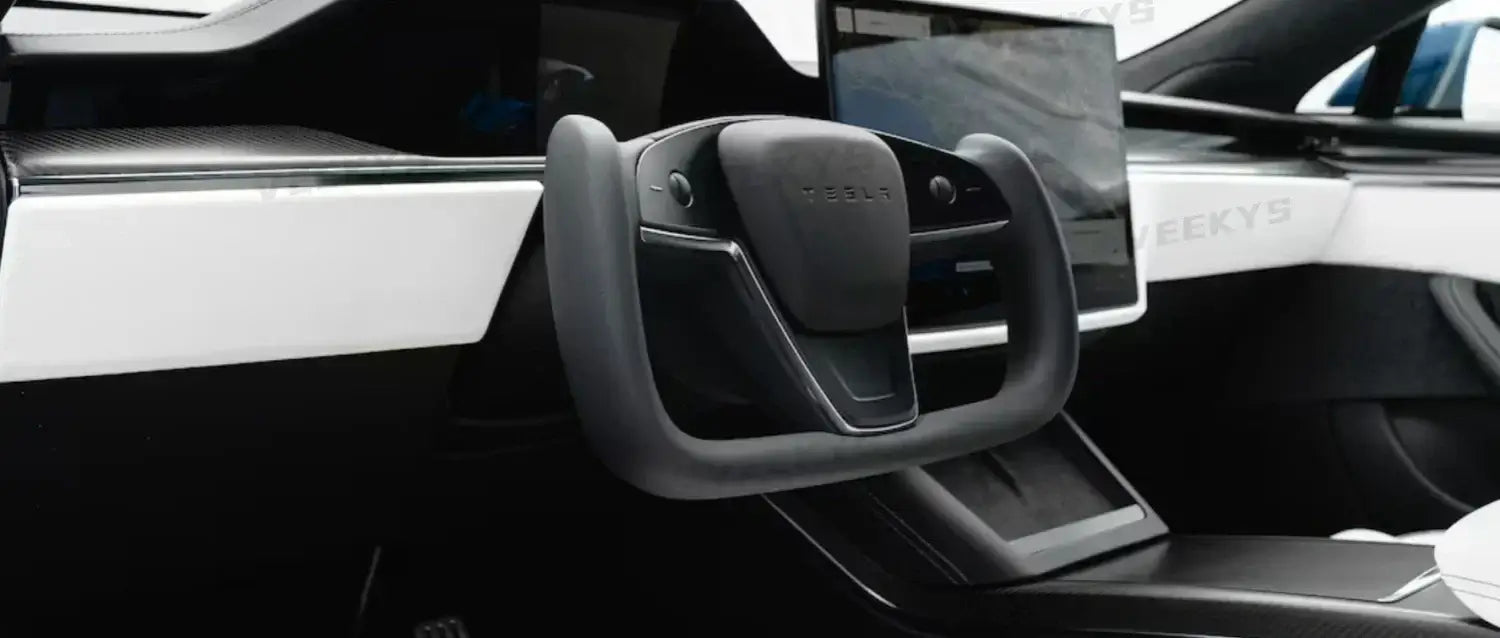 Tesla's 2021 new Model S with steering Yoke shape and stalks removed, shows more benefit or less benefit?