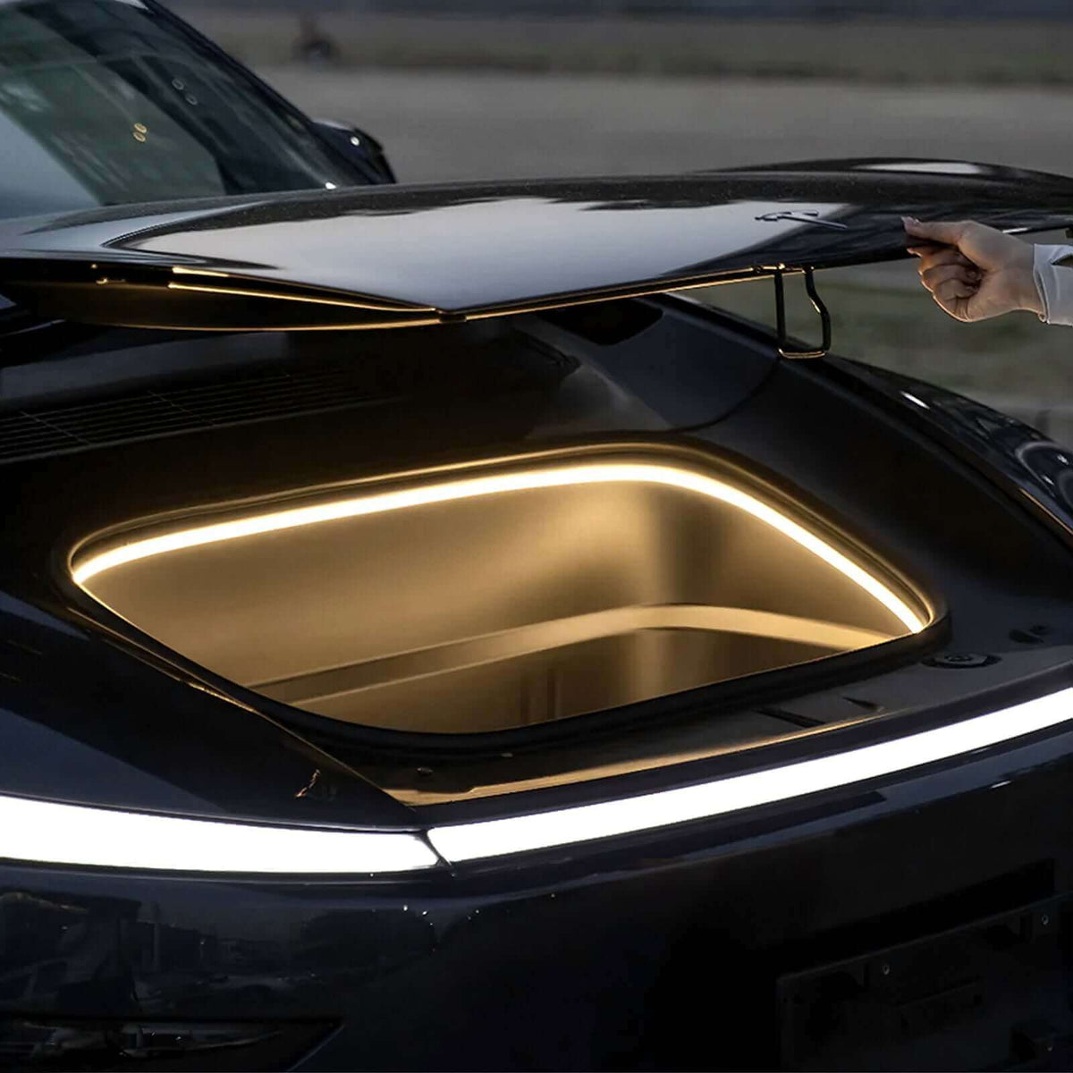 Tesla Model Y Juniper Frunk Light Pro in use with ambient lighting activated inside the frunk