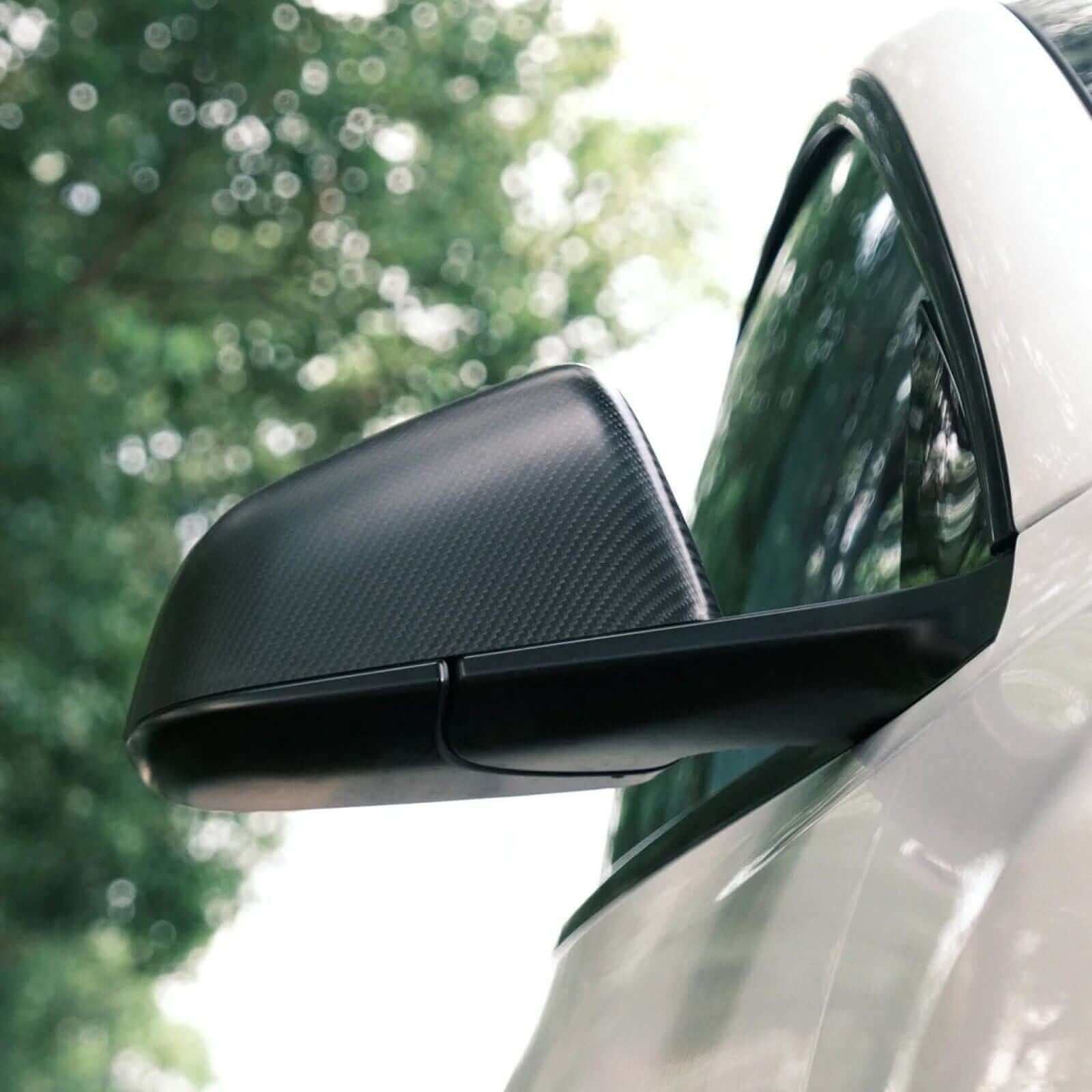 Side view of Real Dry Carbon Fiber Mirror Covers for Tesla Model 3 Highland 2024 showing aggressive style and OEM fit