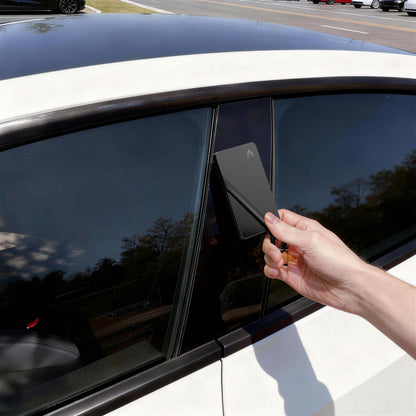 Tesla Model 3 interior with Tesla Key Card Holder in use at window